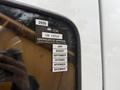 A 2016 Freightliner 108SD with a visible inspection sticker showing certificate of approval details and months of the year listed