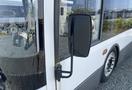 Close-up of the side mirror of a 2017 Grande West Vicinity bus highlighting its black frame and reflective surface