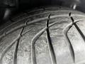 Close-up of a worn tire tread from a 1992 Chevrolet Corvette showing intricate patterns and grooves