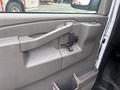 The interior door handle and window controls of a 2022 GMC Savana