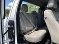 Interior view of a 2016 Ford F-150 showing the rear seat with grey upholstery and seatbelts secured