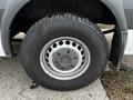 Close-up of a tire on a 2016 Mercedes-Benz Sprinter showcasing a silver rim and a black tire with a tread pattern