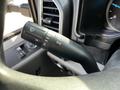A steering column control stalk from a 2018 Ford F-550 with symbols for headlights and turn signals