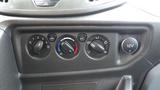 Dashboard controls of a 2018 Ford Transit featuring knobs for air conditioning fan speed temperature and additional settings including a 12V power outlet