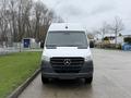 A 2019 Mercedes-Benz Sprinter van with a white exterior and a black front grille positioned directly facing the viewer
