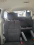 Interior view of a 2012 Dodge Grand Caravan showing black fabric seats with headrests in a spacious arrangement