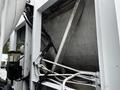 Close-up view of a 2014 Hino 195 truck showing its interior structure including metal supports and various hydraulic hoses and lines