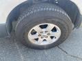 Close-up of a tire and chrome wheel from a 2013 Ford Expedition featuring a Goodyear tire with rugged tread design