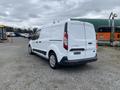 A 2017 Ford Transit Connect in white with sliding side doors and a rear cargo area visible