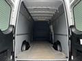 Interior view of a 2019 Mercedes-Benz Sprinter cargo van showing a spacious empty cargo area with side walls and a flat floor