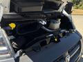 A 2016 RAM Promaster engine compartment with visible components including the air intake system and coolant reservoir