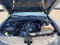 The image shows the engine compartment of a 2019 Dodge Charger with a supercharged V8 engine featuring various components such as hoses and reservoirs