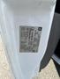 A close-up of the vehicle identification label attached to the door frame of a 2013 Chevrolet Express showing manufacturing details and specifications