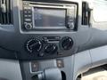 Dashboard of a 2019 Nissan NV200 featuring a center console with audio controls and climate dials