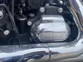 Close-up of a chrome six-speed transmission cover on a 2017 Harley-Davidson FLHTKL motorcycle engine