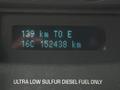 Dashboard display of a 2011 Ford F-550 showing distance to empty as 139 km and total distance traveled as 152438 km
