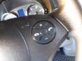 A close-up of a steering wheel control panel from a 2016 Mercedes-Benz Sprinter featuring buttons for volume phone and menu navigation