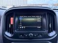 A 2019 Chevrolet Colorado dashboard featuring a touch screen display with a message indicating no device is connected and various control buttons below the screen