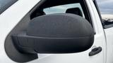 A close-up of the side view mirror of a 2013 Chevrolet Silverado 1500