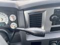 Close-up of the interior dashboard of a 2008 Dodge Ram 5500 featuring gauges for speed and temperature alongside air vents and control panel