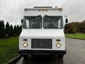 A white 2005 Workhorse W-Series vehicle with a flat front two large windows and a grille featuring round headlights on either side