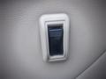 A close-up view of a window control switch on a 2003 Toyota Toyoace interior