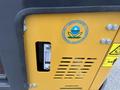 A yellow panel from a 2024 AGT Industrial H13R Mini Excavator featuring a gauge and an Environmental Protection Agency logo