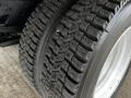 Close-up of a tire from a 2018 Isuzu NRR showcasing deep treads and a robust design suitable for heavy-duty use