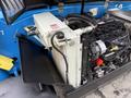 A 2020 Genie GTH-5519 engine with various components including a radiator a fuel tank and electrical parts visible on the side