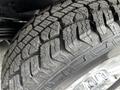 Close-up of a rugged tire tread from a 2020 Ford F-350 SD showing deep grooves designed for off-road traction and durability