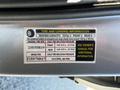 A tire and loading information label for a 2013 Lincoln MKT detailing seating capacity, tire sizes, and inflation pressure requirements