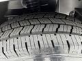 Close-up of a tire from a 2020 Mercedes-Benz Sprinter showing tread pattern and rubber texture