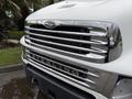 A close-up of a white 2008 Sterling Acterra truck's front grille showcasing chrome accents and the brand name Sterling prominently displayed