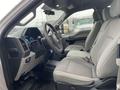 Interior of a 2017 Ford F-250 SD featuring grey cloth seats and a modern dashboard with speedometer and controls visible