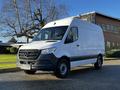 2021 Mercedes-Benz Sprinter van in white with a black front grille and wheels parked at an angle