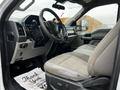 Interior view of a 2020 Ford F-350 SD showing the driver's seat and dashboard with modern controls and a steering wheel