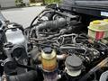2020 Hino 338 engine with various components including pipes wires and reservoirs visible in the engine compartment