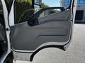 Interior door panel of a 2020 Hino 155 featuring a sleek design with a gray finish and a handle for opening the door