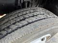 Close-up of a worn tire from a 2014 Hino 195 showing tread wear and surface texture