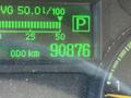 Dashboard display of a 2015 Mitsubishi Fuso FE showing a mileage reading of 90876 km and fuel consumption indicator