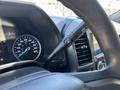 Close-up view of the dashboard of a 2020 Ford F-350 SD showing the speedometer and gear shift lever