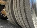 A close-up view of the tires on a 2000 Ford Motorhome showcasing their tread patterns and wear marks