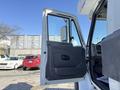 The open door of a 2008 International 7500 truck showcasing the interior with a visible dashboard and driver's seat