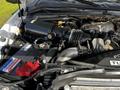 Close-up view of the engine of a 2008 Ford F-550 showing various components including the air intake, battery, and hoses