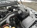 Close-up view of the engine bay of a 2017 Ford F-150 with visible components including air intake and engine cover