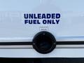 A fuel inlet cap for a 2019 Ford Econoline with a label indicating unleaded fuel only