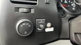 Dashboard controls of a 2013 Chevrolet Silverado 1500 including light settings and cruise control buttons