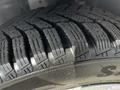 Close-up of a tire on a 2016 Ford Transit Connect showcasing tread patterns designed for traction and grip on various surfaces