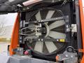 A large cooling fan assembly from a 2018 Doosan DL300-5 with visible blades and connected hoses and controls