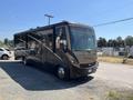 2008 Newmar Canyon Star 36 Foot Class A Motorhome with a sleek exterior design and large front windshield parked at an angle